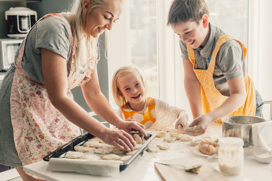 Mom Cooking With Kids On The Kitchen