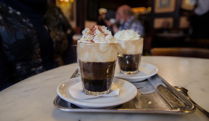vienna coffee with whipped milk and orange licker