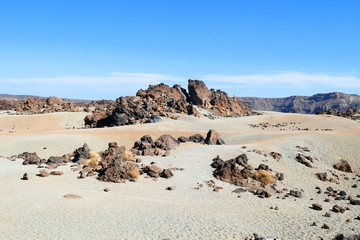sand and rocks desert landscape in Teide National Park in sunny day, Tenerife Island, Canary...