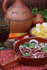 Lobio with corn porridge with cheese and red wine