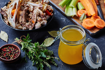 cooked chicken stock in a glass jar