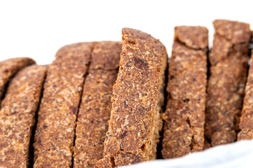 wholegrain bread on white background, macro photo