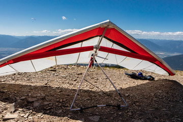 Hang gliders on the mountain in Creston, British Columbia, Canada. Delta plane parked on the ground. Extreme holidays in nature