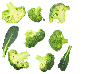 green broccoli with slices and leaves isolated on white background. top view