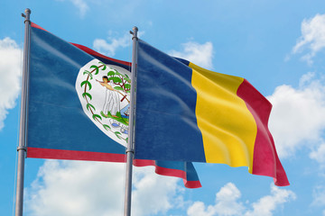 Fototapeta na wymiar Chad and Belize flags waving in the wind against white cloudy blue sky together. Diplomacy concept, international relations.