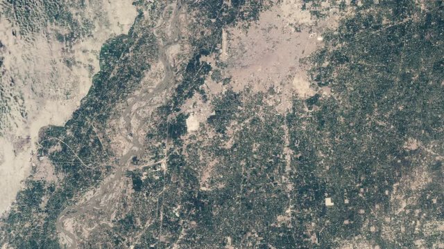 Field flooded by river mud water inundation time lapse animation. Images furnished by Nasa