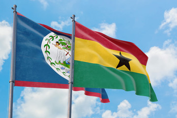 Ghana and Belize flags waving in the wind against white cloudy blue sky together. Diplomacy concept, international relations.