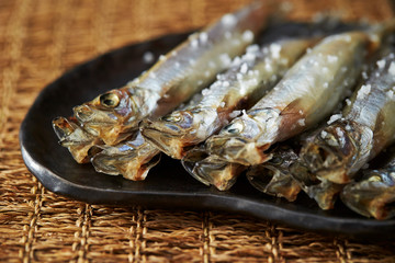 Salted dried fish on plate
