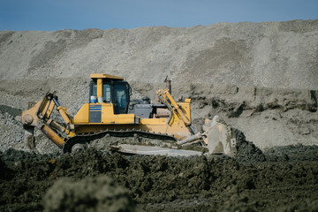 Obraz premium Bulldozer work at the gold mining site.