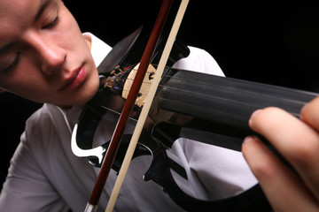 Young men playing the violin