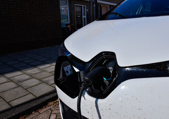 Edam, the Netherlands, August 2019. A Renault Zoe connected to the electric charging station. The...