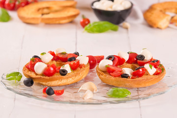 Friselle with tomatoes and mozzarella cheese.