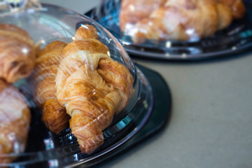 Fresh and delicious croissants on table