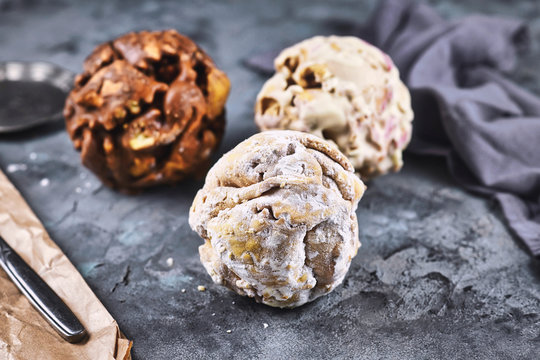Different flavors of ball shaped traditional German sweet food called 'Schneeballen', meaning 'Snowball', made from shortcrust pastry, a speciality from tourist city Rothenburg