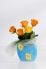 Bouquet of beautiful yellow roses on light gray background