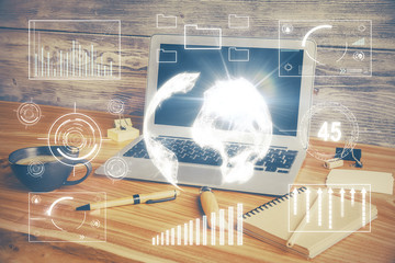 Double exposure of chart and financial info and work space with computer background. Concept of international online trading.