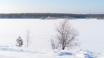Winter landscape.Snow covered lake in North Finland.