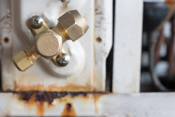 The air conditioner is damaged. Refrigerant leaks from the system.  Must be repaired by a technician.