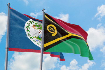 Vanuatu and Belize flags waving in the wind against white cloudy blue sky together. Diplomacy concept, international relations.