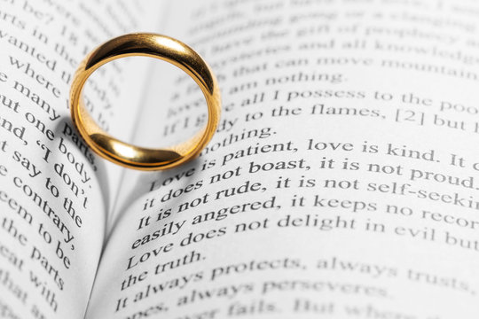 Golden wedding ring on bible book
