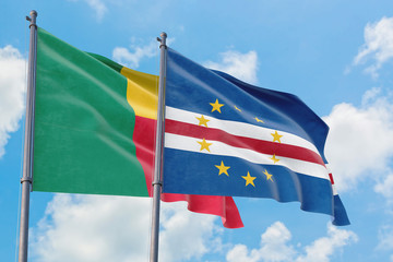 Cape Verde and Benin flags waving in the wind against white cloudy blue sky together. Diplomacy concept, international relations.