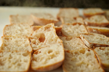 Slicing bread half on cutting board 