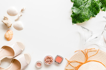 Summer female accessories. Cosmetics, clothes, shoes on white background top-down frame copy space