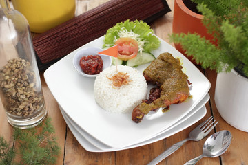 Traditional fried chicken with rice and salad
