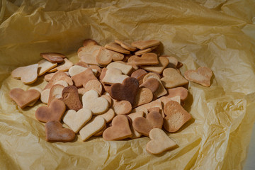  These heart-shaped cookies are on a gold background.