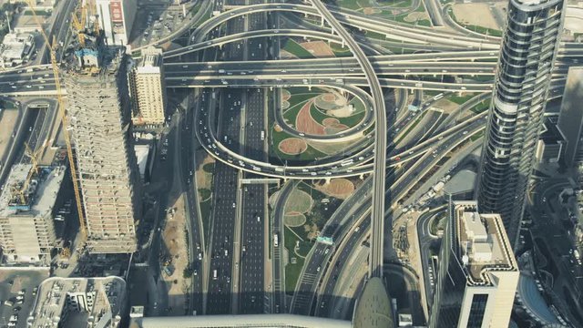 A busy city road interchange in Dubai Downtown, aerial view. United Arab Emirates