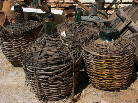 Glass bottles protected by straw cover