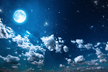 Fototapeta na wymiar backgrounds night sky with stars and moon and clouds.