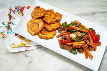 Chopped steak or Bistec Picao and patacones or tostones are fried green plantain slices, made with green plantains, Tipical Panamá food, Panamá, Central America