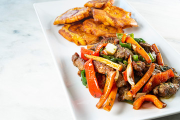 Chopped steak or Bistec Picao and patacones or tostones are fried green plantain slices, made with green plantains, Tipical Panamá food, Panamá, Central America