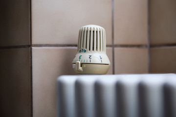 The thermostat in ecology mode of an radiator of an old central heating in Germany, Nuremberg