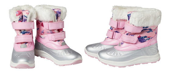 Pink textile and ruber snow boots with faux fur isolated on white background with clipping path. Winter shoes. Studio shot