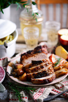 Roasted pork loin with apples.style rustic