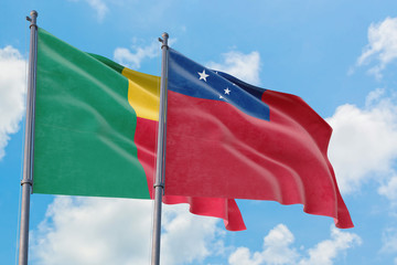 Samoa and Benin flags waving in the wind against white cloudy blue sky together. Diplomacy concept,...