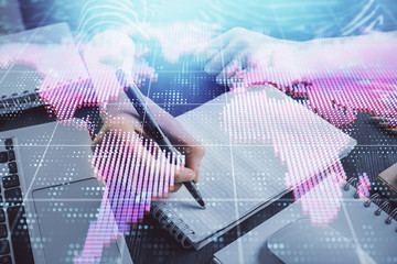 International business hud over woman's hands writing background. Concept of hard work. Double...