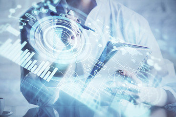 International business hud over woman's hands writing background. Concept of hard work. Double exposure