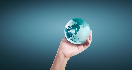 Globe ,earth in human hand, holding our planet glowing