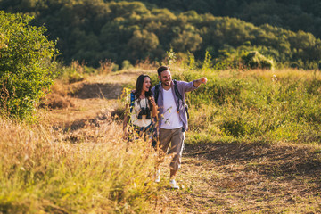 Fototapeta premium Happy couple is hiking in mountain.