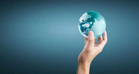 Globe ,earth in human hand, holding our planet glowing