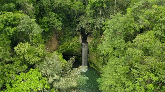 Aerial drone flight over Air Terjun Tibumana waterfall, Bali, Indonesia, 4k