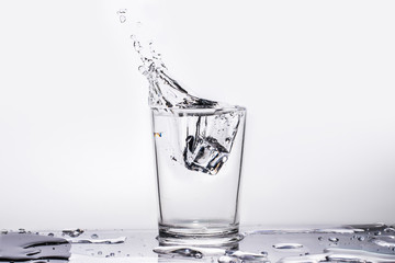 Water splashes in a glass. Isolated background
