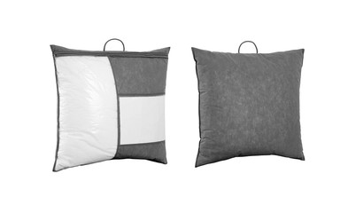 Soft pillows in the grey plastic retail bag with empty label against white. Pillows in the package bag isolated. Bedspread packed in to the PVC bag. Front and back side.