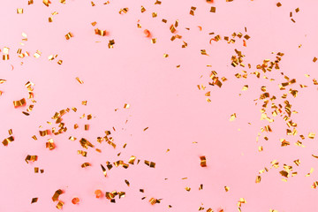 Golden flying sparkles on pink  holiday background. Festive backdrop for your projects. - Image
