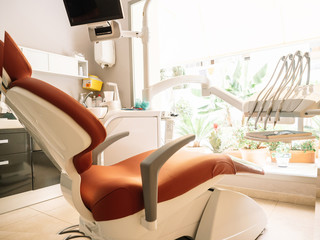 A dentist's clinic. Working armchair with utensils and tools.