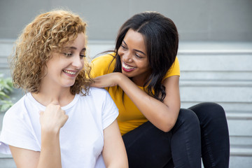 happy woman with different skin color friend spending good time together; concept of ethnicity and skin color difference tolerance, love and peace, friendship, social diversity