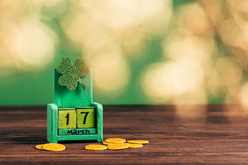 Calendar with the date March 17. and shamrock clover on a green background. St. Patrick's Day concept.